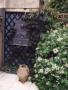 A wall fountain by the back door